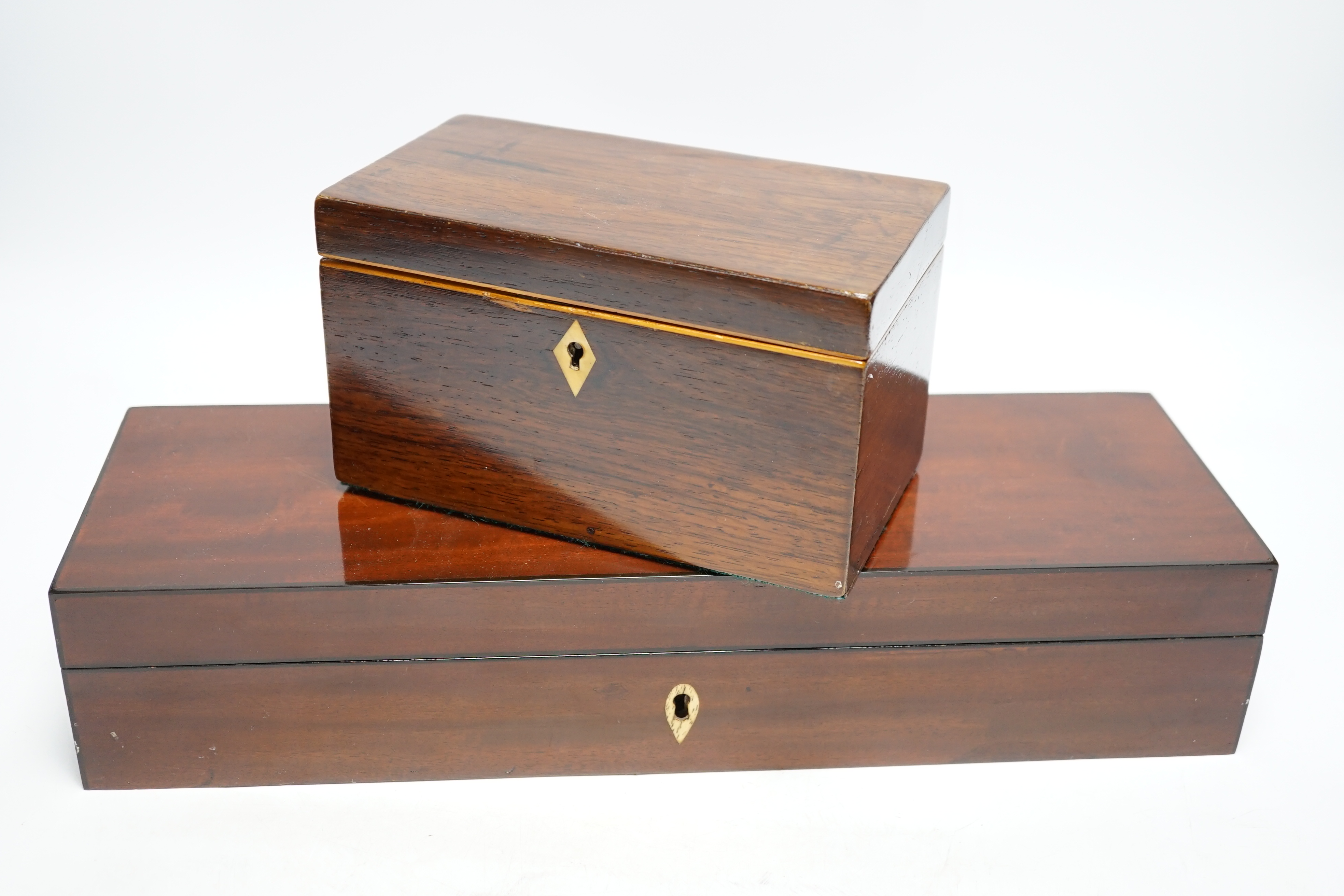 A 19th century mahogany glove box, three pairs of kid leather gloves and a rosewood tea caddy with bone escutcheon, glove box 40cm wide